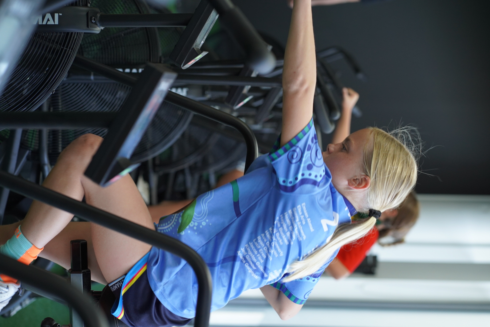 Athlete on air bike at Rep Ready