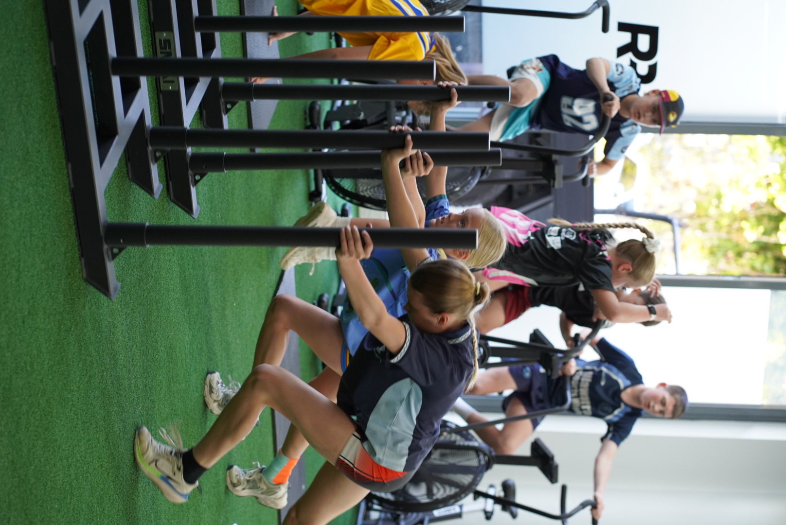 Athletes pushing sleds at Rep Ready